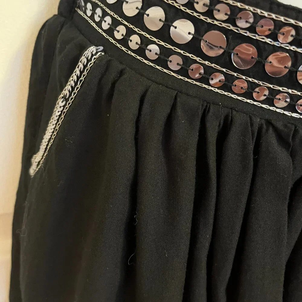Justice black skort with silver sparkly trim along waistline and hem sz 12
